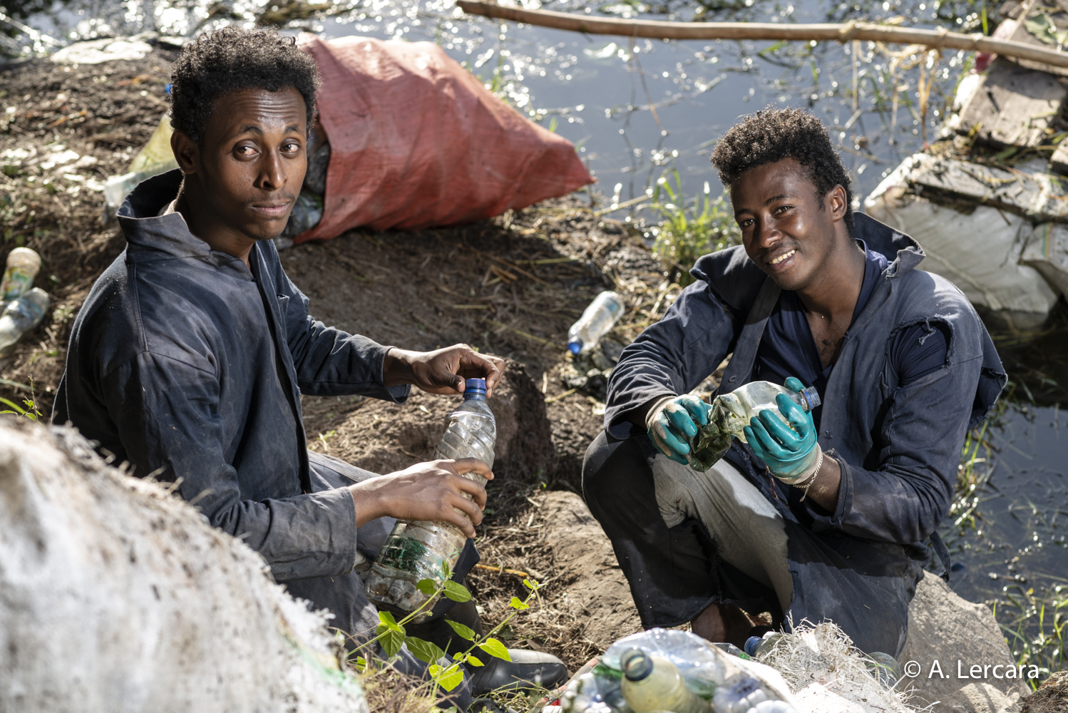 Adissu and Fasil, collecting plastic bottles on Hawassa lake